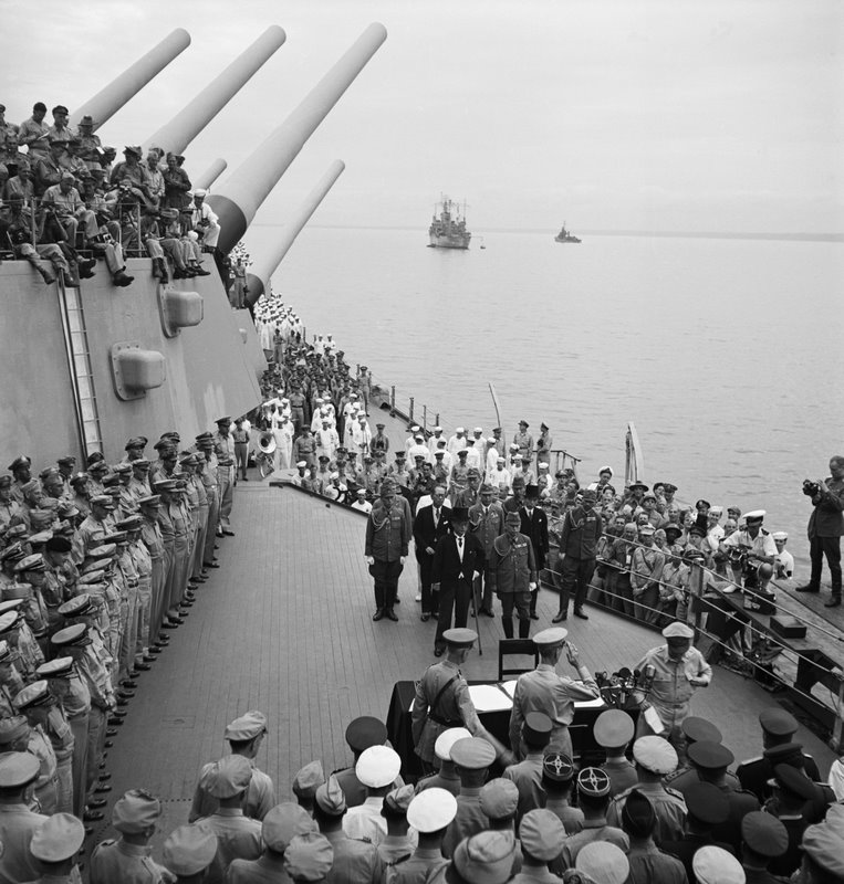 The picture shows the surrender ceremony officially ending World War II in 