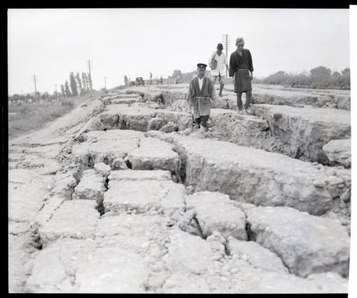 A concrete highway cascaded adn split open as much as five feet